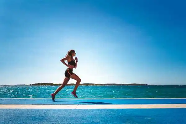 Woman running showing strong leg muscle Dunchurch